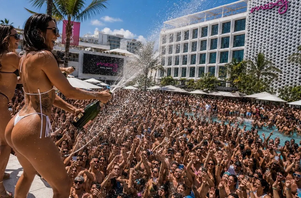 Moxy pool party guests celebrating